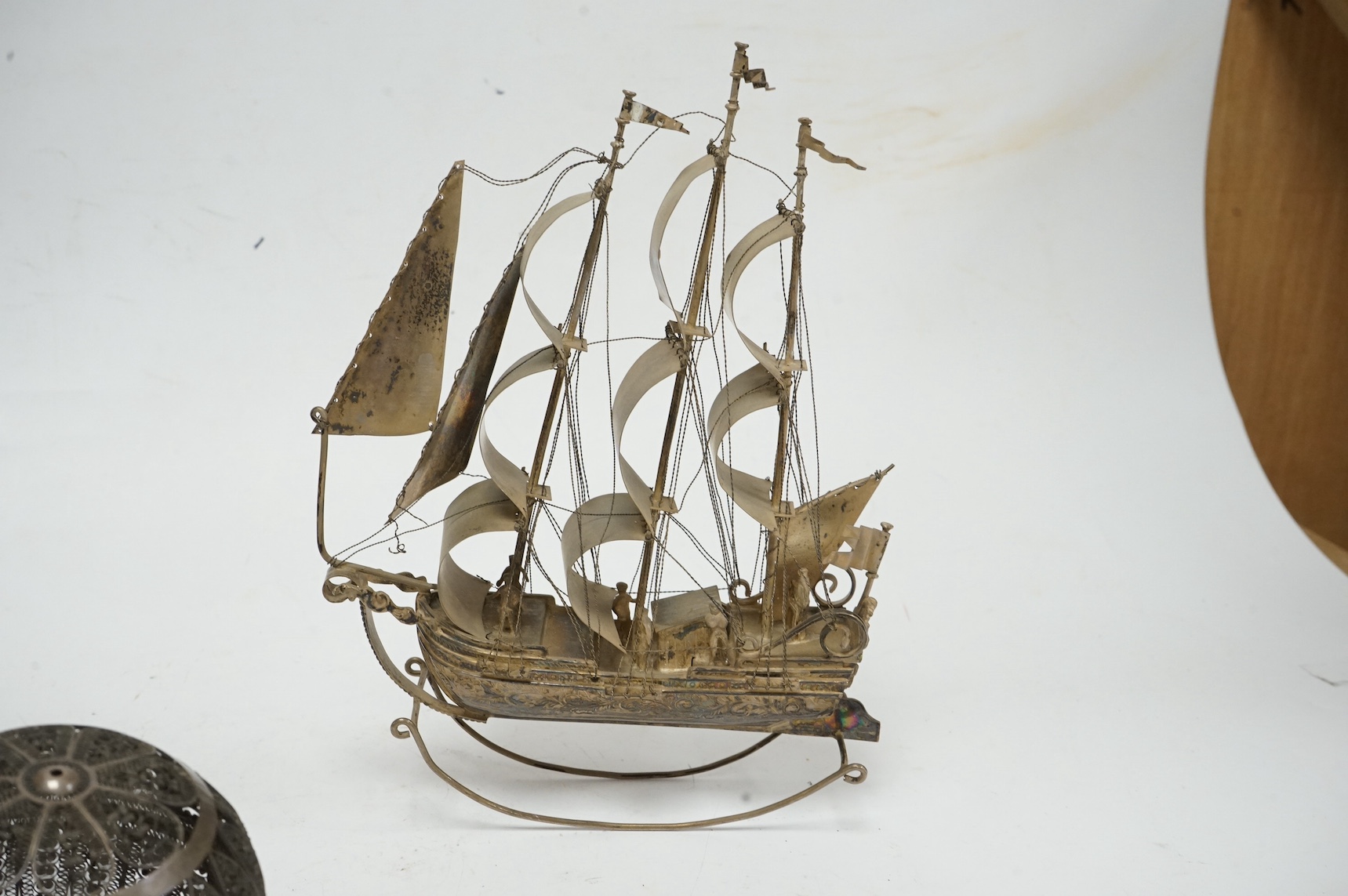 A Dutch? miniature white metal model of a three masted ship, on a rocking base, height 21.7cm, together with a filigree white metal pomander, makers mark IT? and an 18th century shagreen mounted white metal etui with acc